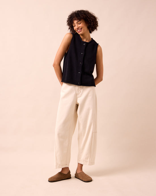 model wears tia black knitted vest