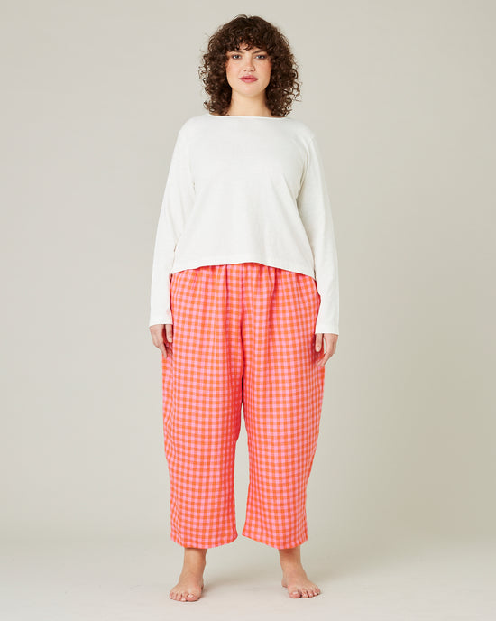 model wears tomato and pink check PJ trousers