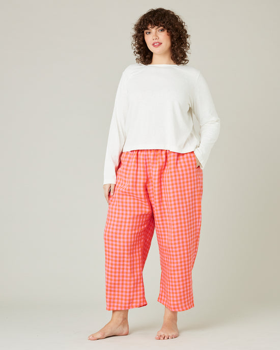 model wears tomato and pink check PJ trousers