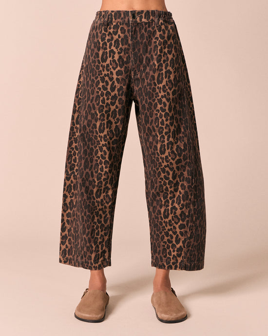 model wears tori dark leopard denim jeans front