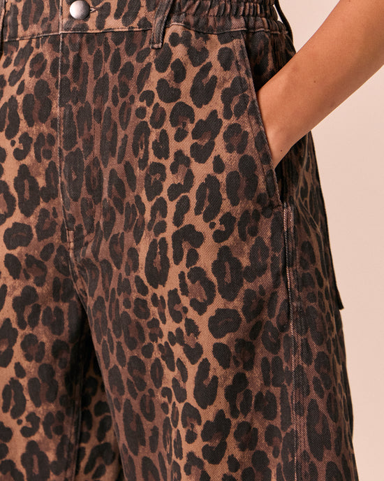 model wears tori dark leopard denim jeans 