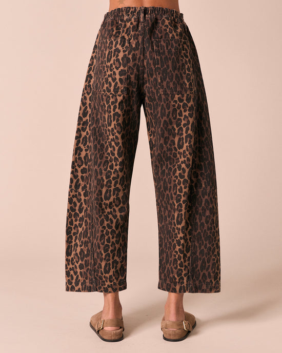 model wears tori dark leopard denim jeans back