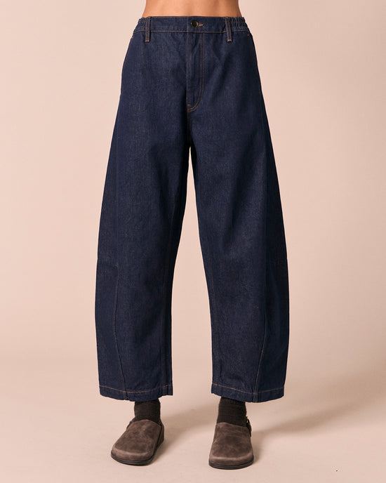 model wears tori indigo rinse denim jeans front