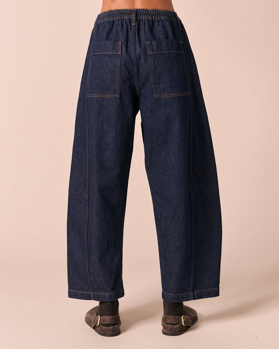 model wears tori indigo rinse denim jeans back