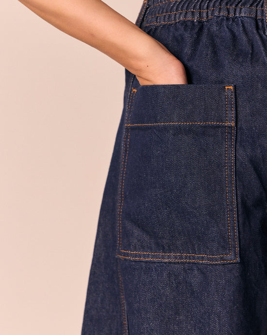 model wears tori indigo rinse denim jeans