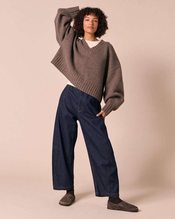model wears tori indigo rinse denim jeans left