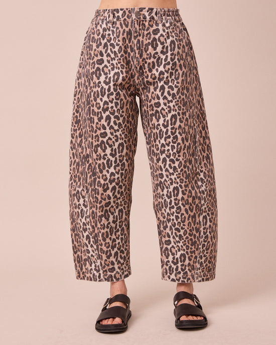 model wears tori leopard print denim jeans front