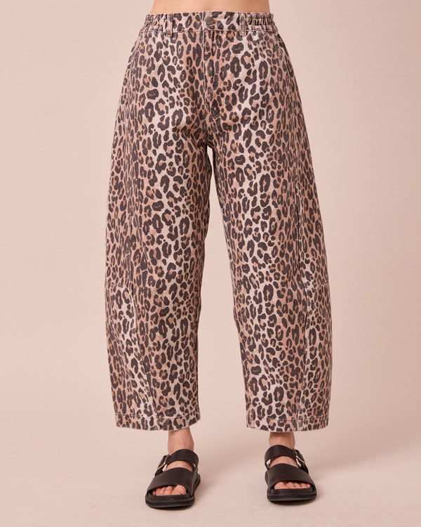 model wears tori leopard print denim jeans front