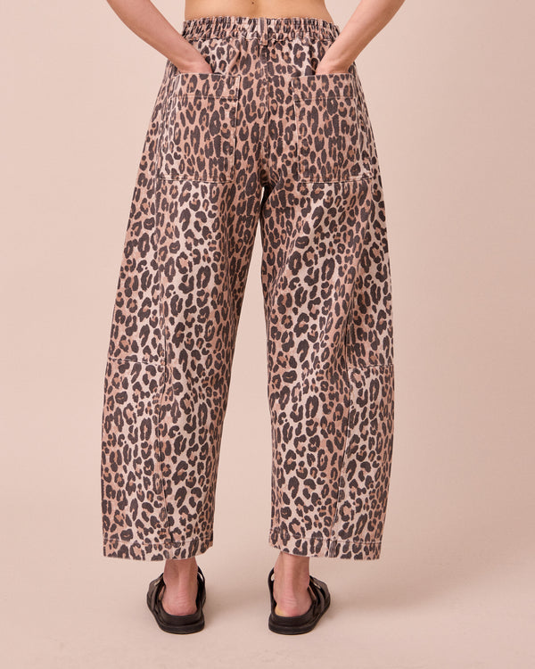 model wears tori leopard print denim jeans back