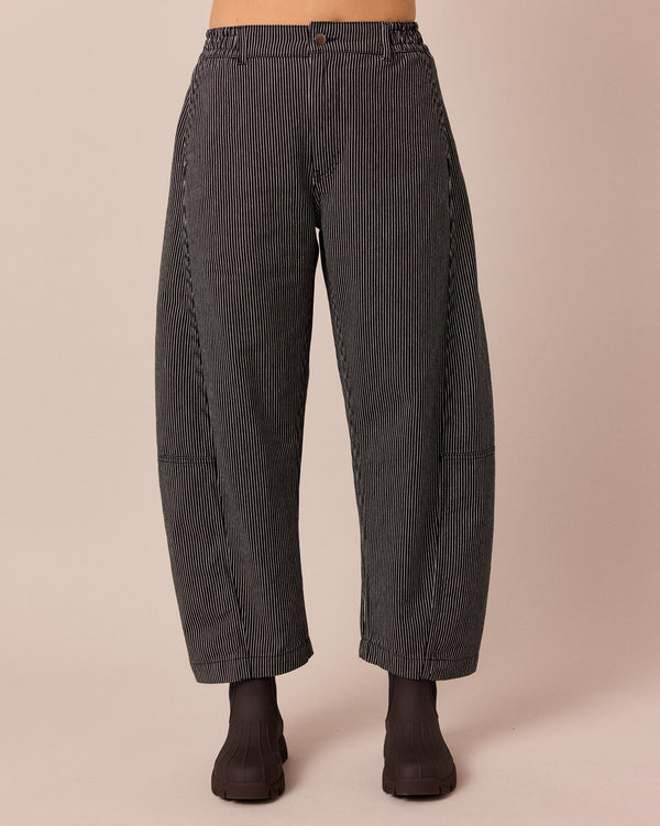 model wears tori black hickory stripe denim jeans front