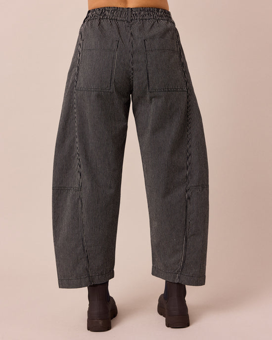 model wears tori black hickory stripe denim jeans back