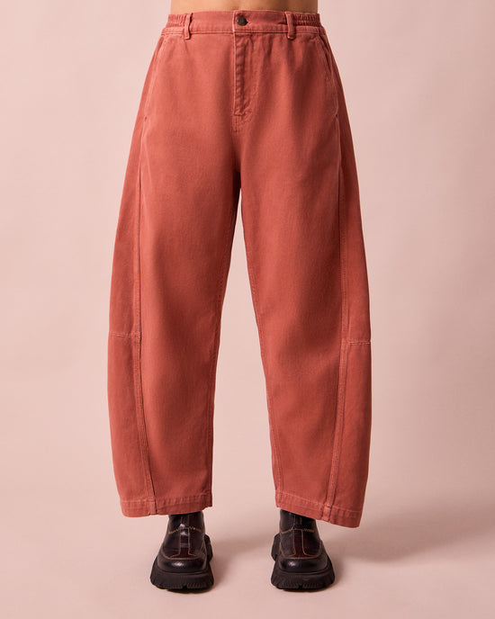 model wears tori clay pink denim jeans