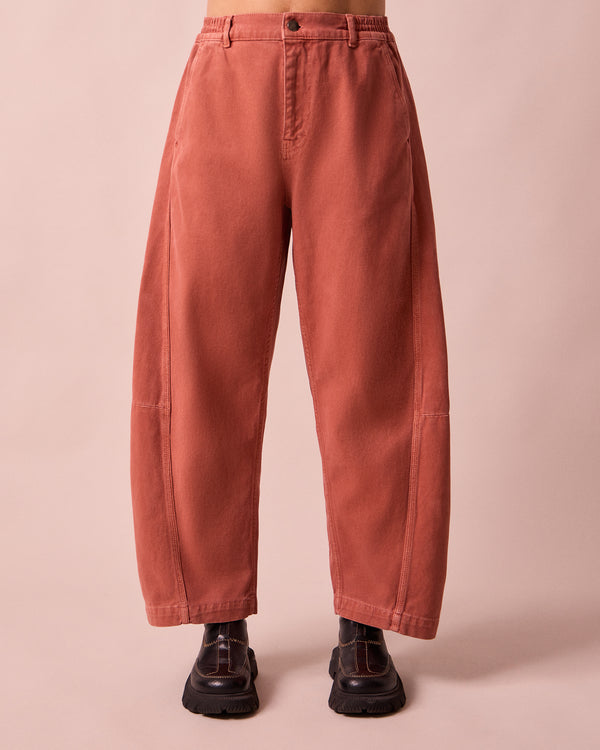 model wears tori clay pink denim jeans