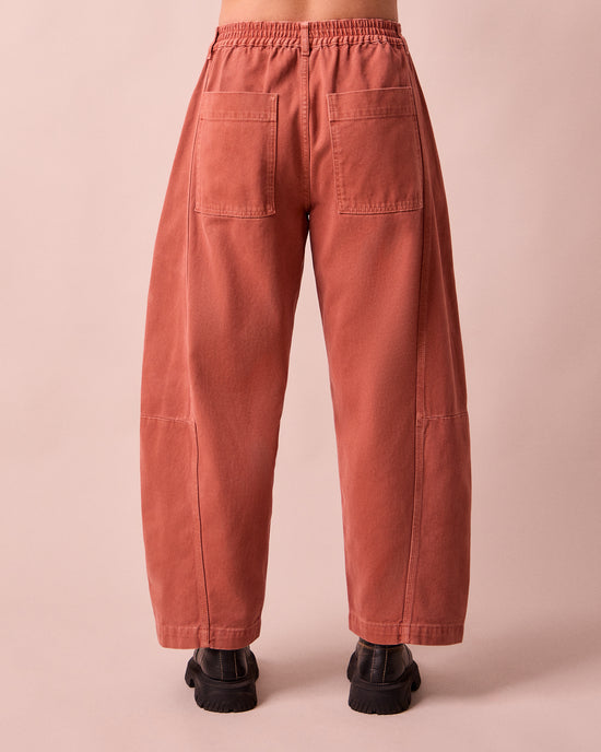 model wears tori clay pink denim jeans