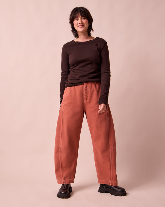 model wears tori clay pink denim jeans