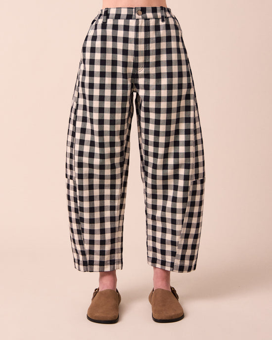 model wears tori black and white check denim jeans front