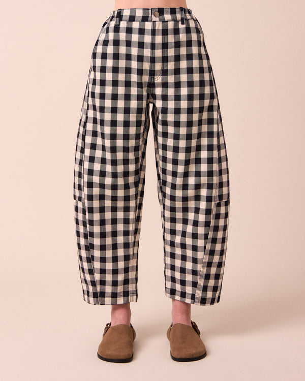 model wears tori black and white check denim jeans front