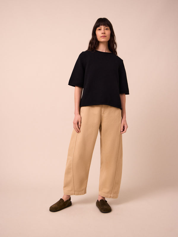 model wears tori sandstone denim jeans right