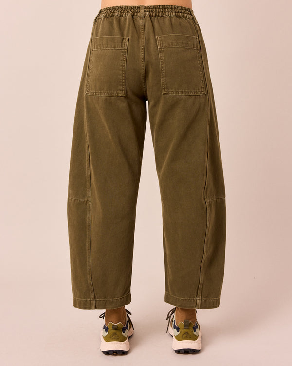 model wears tori olive denim jeans back