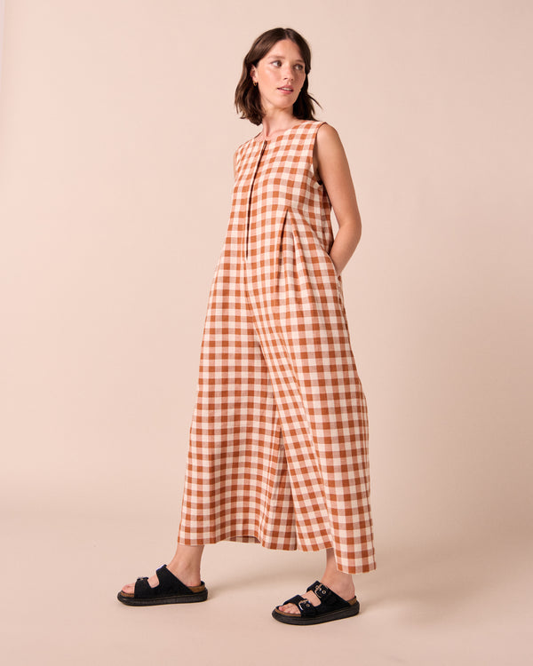 model wears tula amber check linen jumpsuit