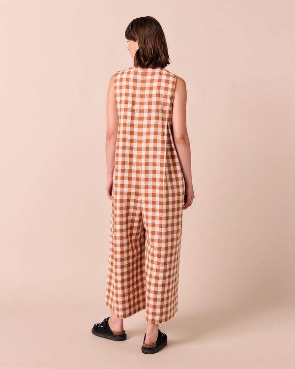 model wears tula amber check linen jumpsuit