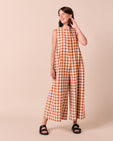 model wears tula amber check linen jumpsuit