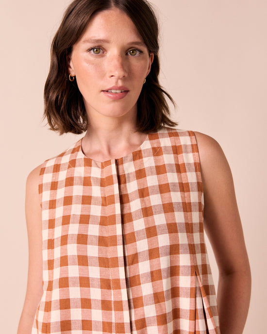 model wears tula amber check linen jumpsuit
