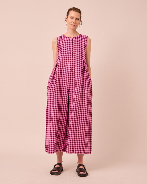 model wears tula summer berry gingham linen jumpsuit