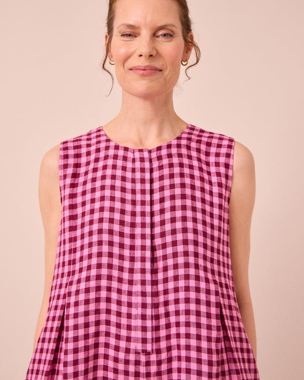 model wears tula summer berry gingham linen jumpsuit