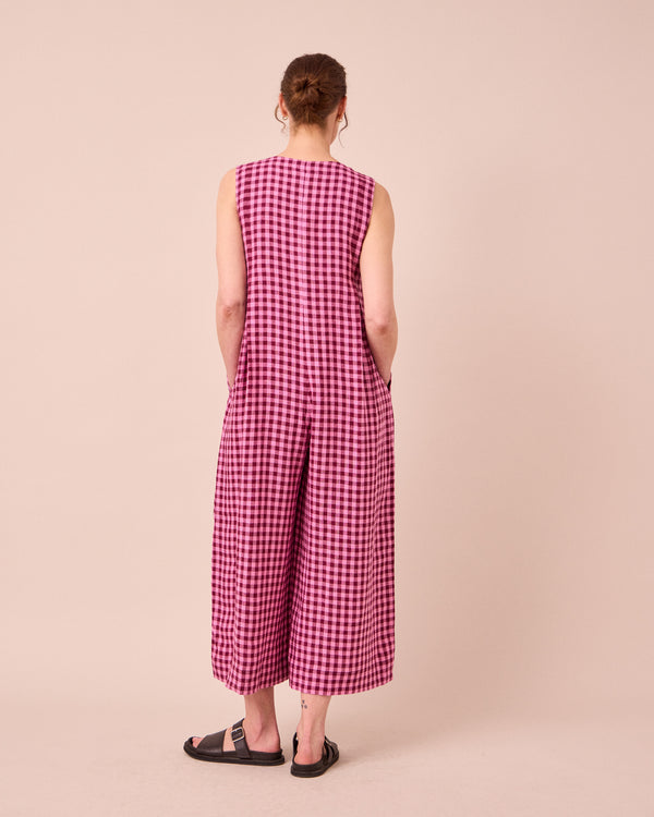 model wears tula summer berry gingham linen jumpsuit