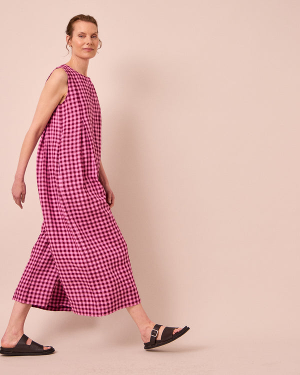 model wears tula summer berry gingham linen jumpsuit