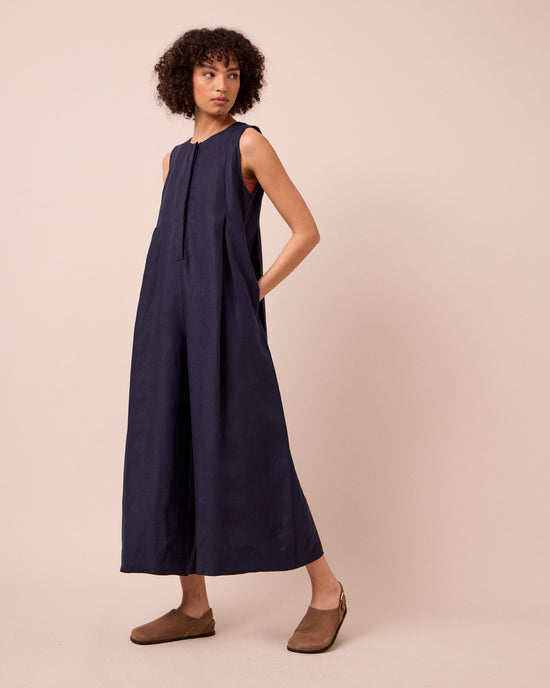 model wears tula navy linen jumpsuit