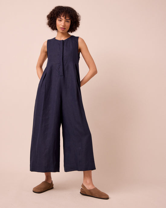 model wears tula navy linen jumpsuit