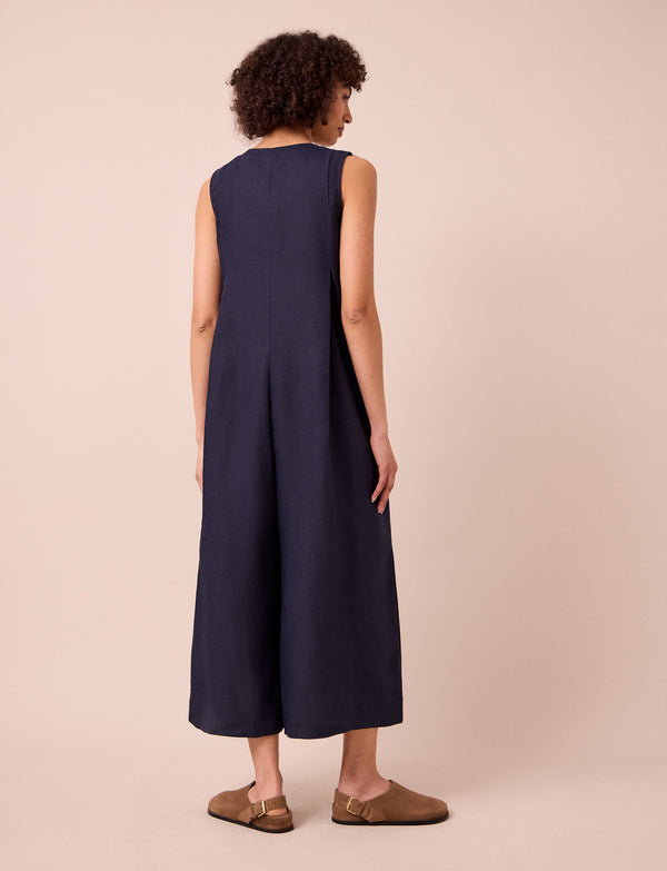 model wears tula navy linen jumpsuit