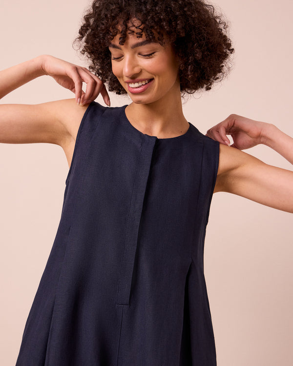 model wears tula navy linen jumpsuit