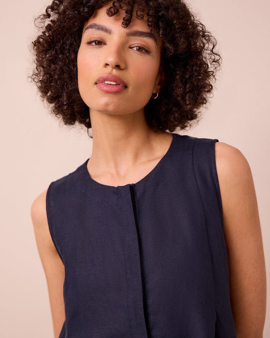 model wears tula navy linen jumpsuit