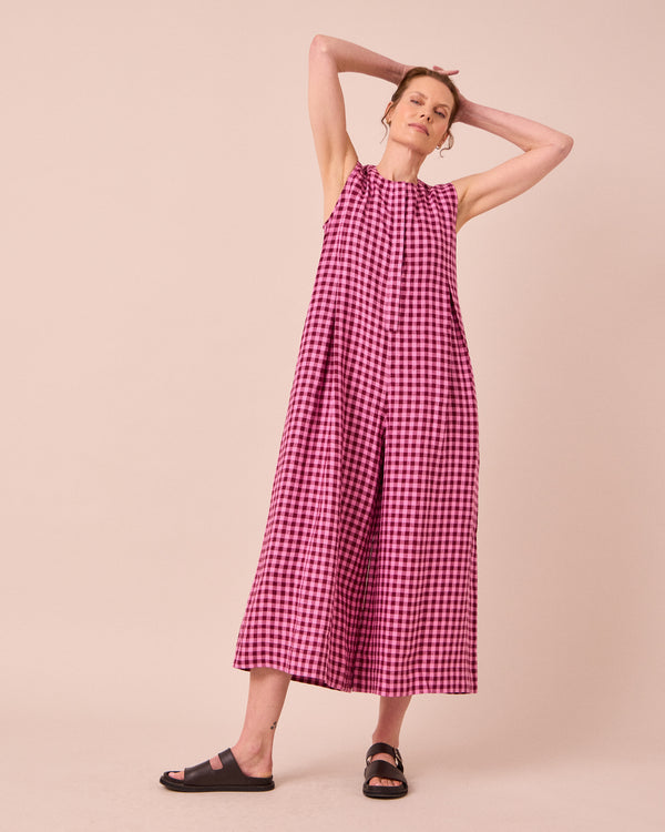 model wears tula summer berry gingham linen jumpsuit