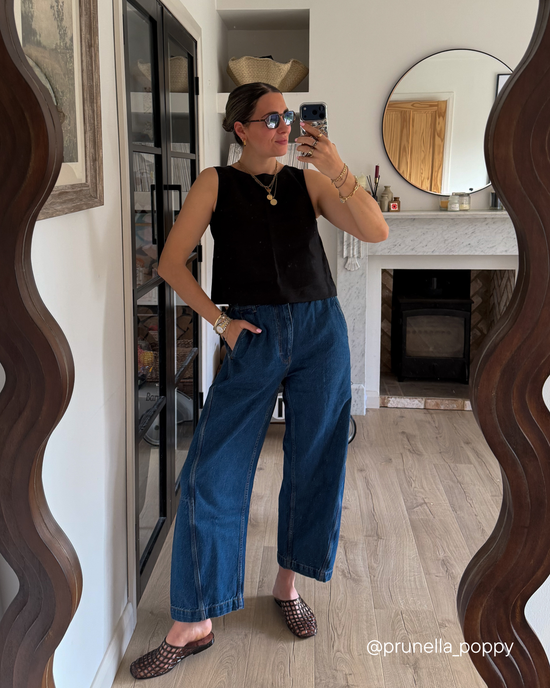 model wears tori mid blue denim jeans
