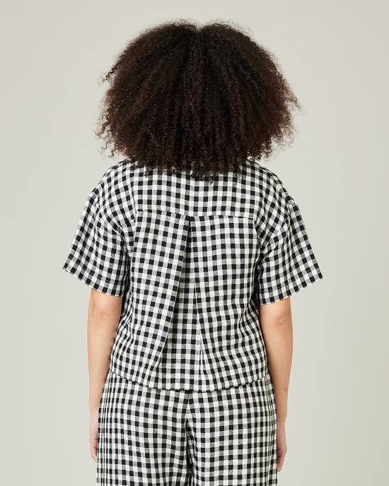 model wears black and white gingham linen pj top 