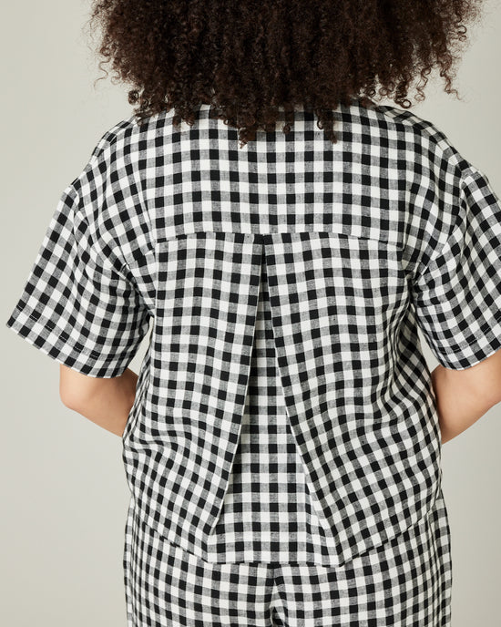 model wears black and white gingham linen pj top 