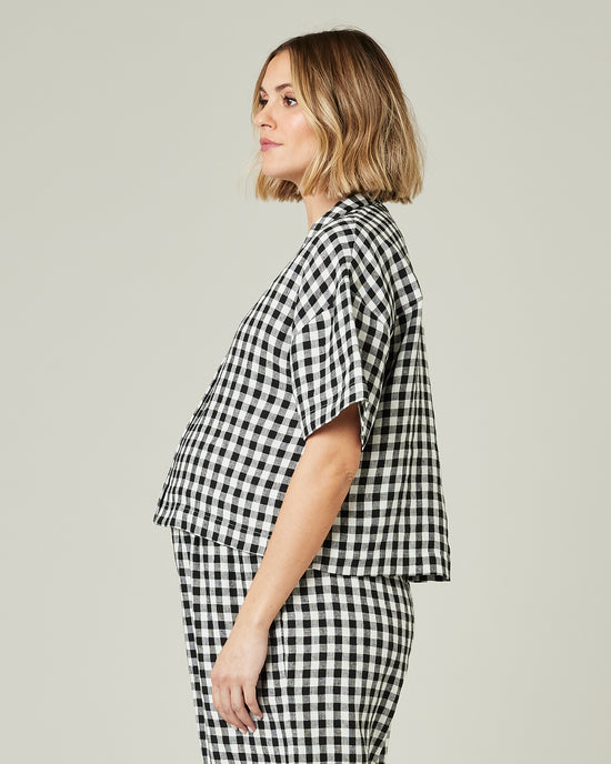 pregnant model wears black and white gingham linen pj top 