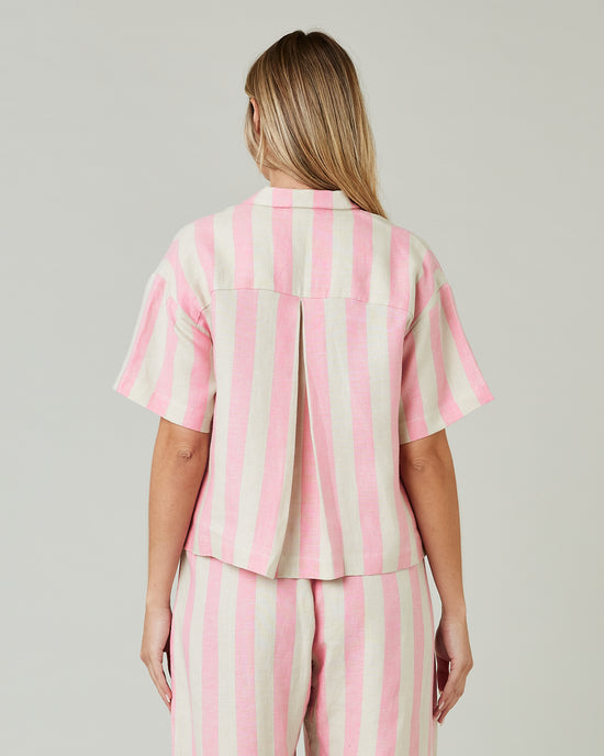 pregnant model wears pink and ecru stripe ultimate pj top 