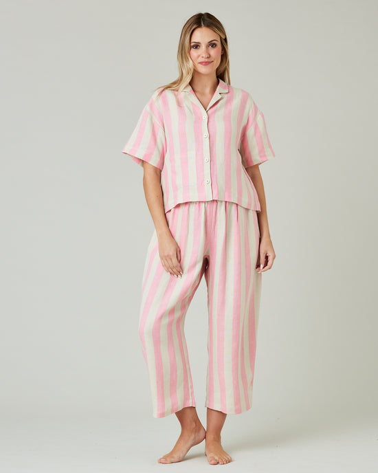 pregnant model wears pink and ecru stripe ultimate pj top 