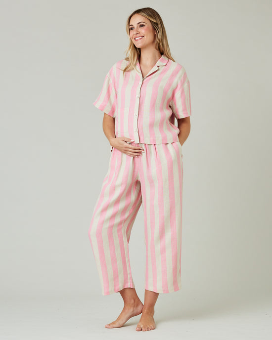 pregnant model wears pink and ecru stripe ultimate pj top 