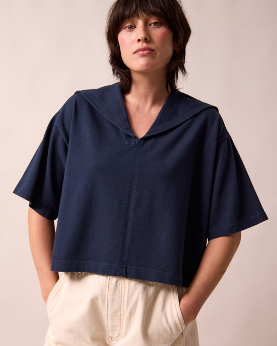 model wears uma navy jersey top