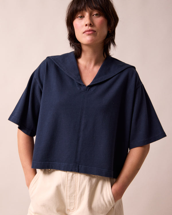 model wears uma navy jersey top