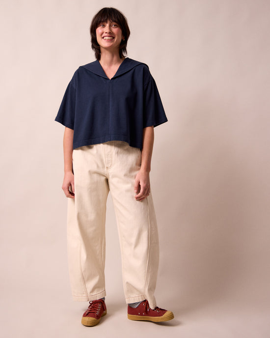 model wears uma navy jersey top