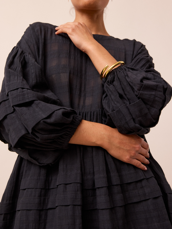 model wears black nina smock dress 