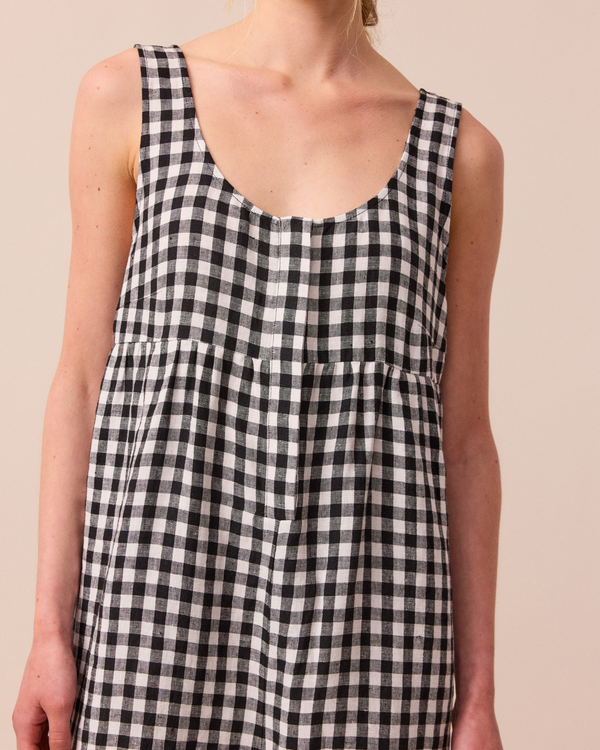 model wears black and white gingham savannah linen jumpsuit