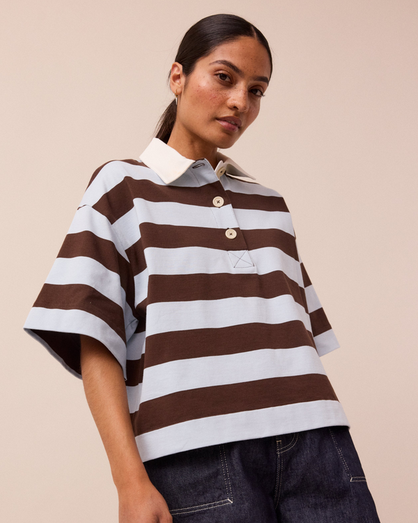 model wears ralph sky blue and brown stripe jersey rugby top